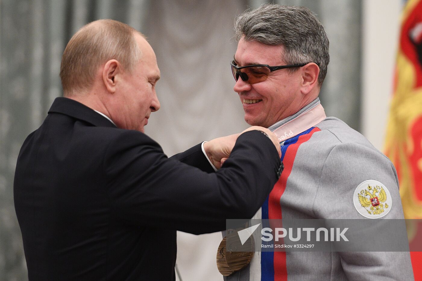 Russian President Vladimir Putin meets with Russian athletes - winners and medalists of 12th Paralympic Winter Games