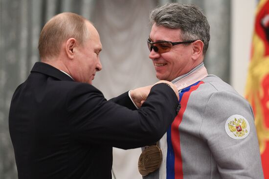 Russian President Vladimir Putin meets with Russian athletes - winners and medalists of 12th Paralympic Winter Games