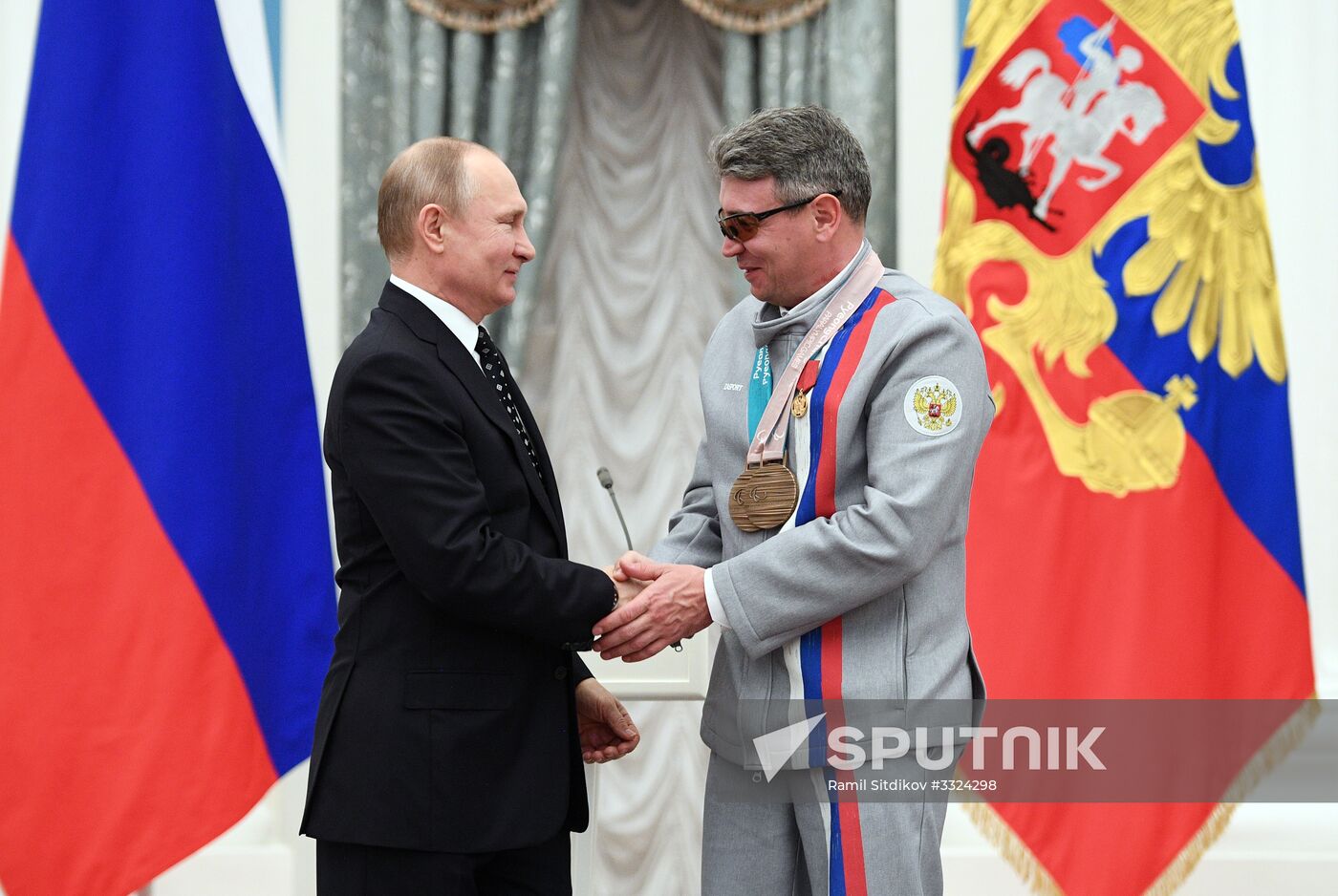 Russian President Vladimir Putin meets with Russian athletes - winners and medalists of 12th Paralympic Winter Games