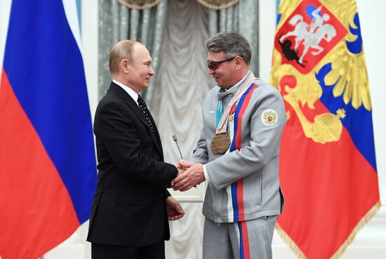 Russian President Vladimir Putin meets with Russian athletes - winners and medalists of 12th Paralympic Winter Games
