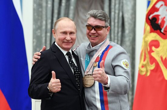 Russian President Vladimir Putin meets with Russian athletes - winners and medalists of 12th Paralympic Winter Games