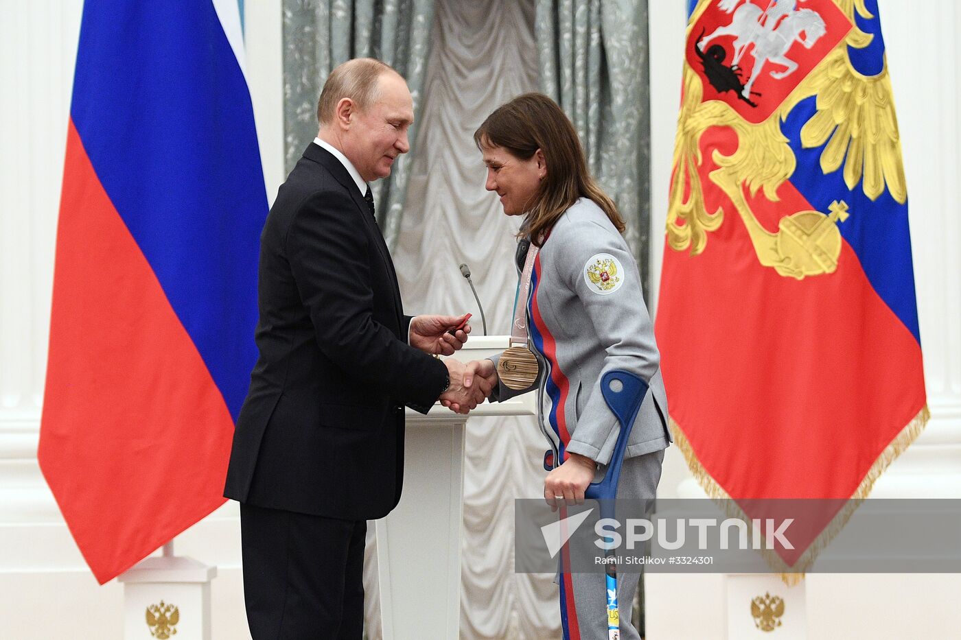 Russian President Vladimir Putin meets with Russian athletes - winners and medalists of 12th Paralympic Winter Games