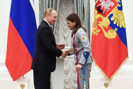 Russian President Vladimir Putin meets with Russian athletes - winners and medalists of 12th Paralympic Winter Games