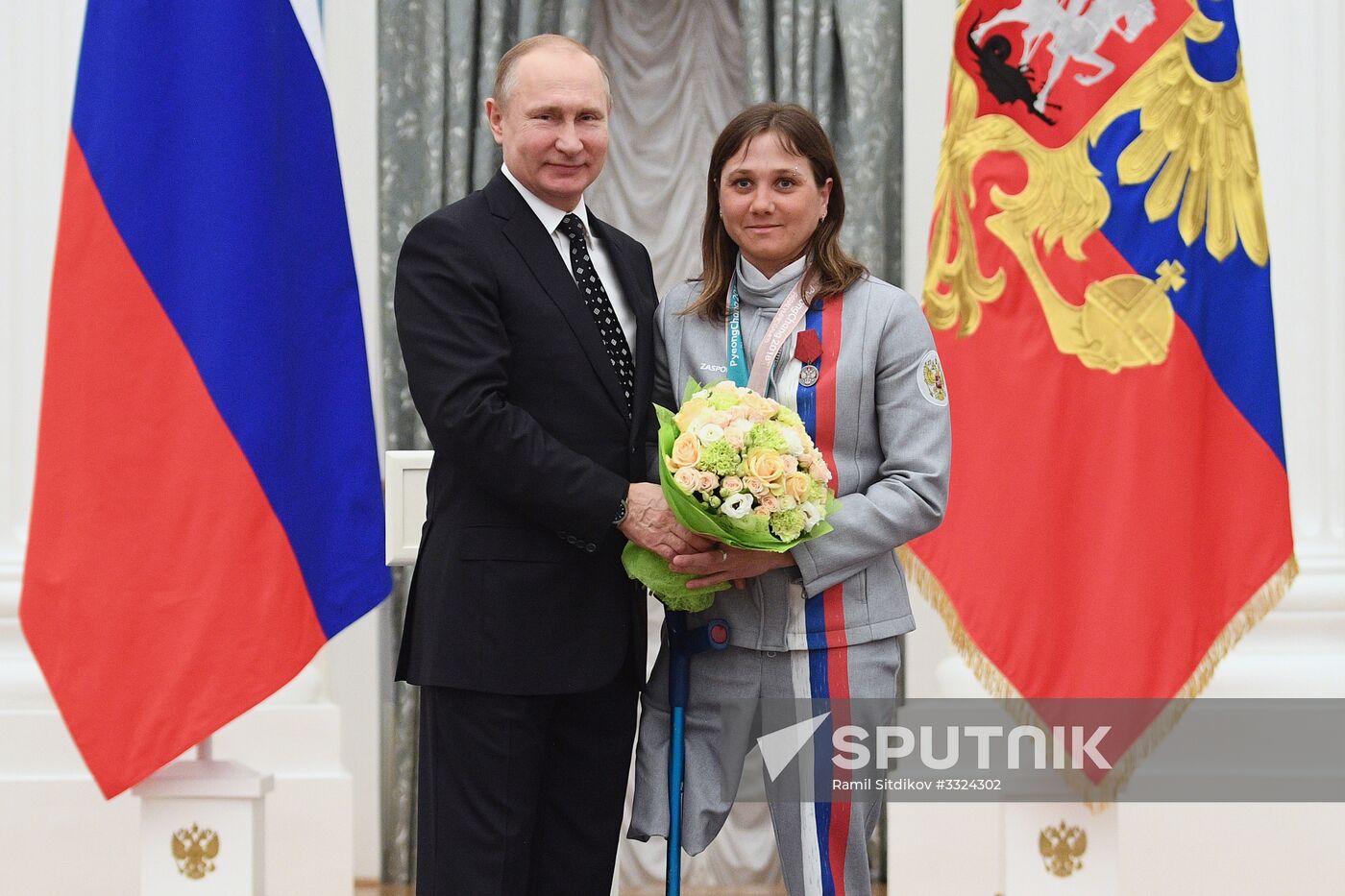 Russian President Vladimir Putin meets with Russian athletes - winners and medalists of 12th Paralympic Winter Games