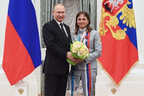Russian President Vladimir Putin meets with Russian athletes - winners and medalists of 12th Paralympic Winter Games