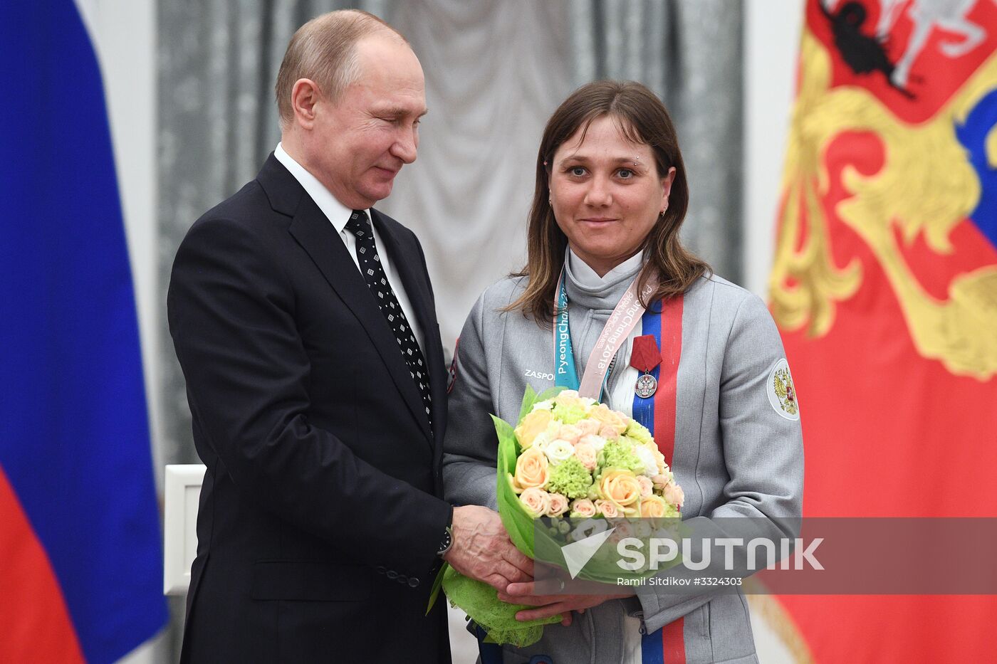 Russian President Vladimir Putin meets with Russian athletes - winners and medalists of 12th Paralympic Winter Games