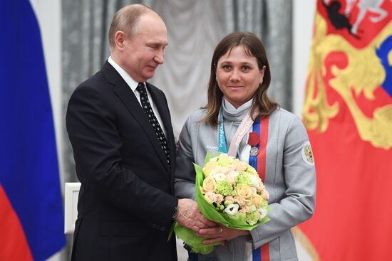 Russian President Vladimir Putin meets with Russian athletes - winners and medalists of 12th Paralympic Winter Games