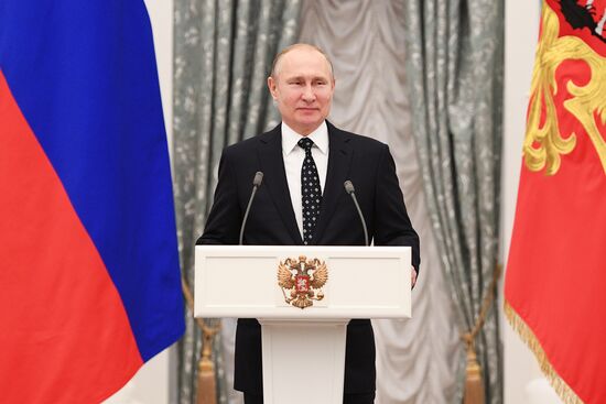 Russian President Vladimir Putin meets with Russian athletes - winners and medalists of 12th Paralympic Winter Games