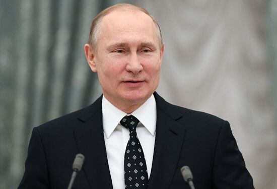 Russian President Vladimir Putin meets with Russian athletes - winners and medalists of 12th Paralympic Winter Games