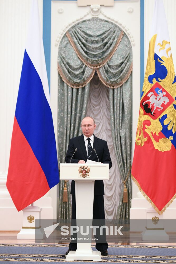 Russian President Vladimir Putin meets with Russian athletes - winners and medalists of 12th Paralympic Winter Games