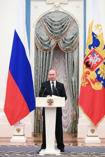 Russian President Vladimir Putin meets with Russian athletes - winners and medalists of 12th Paralympic Winter Games