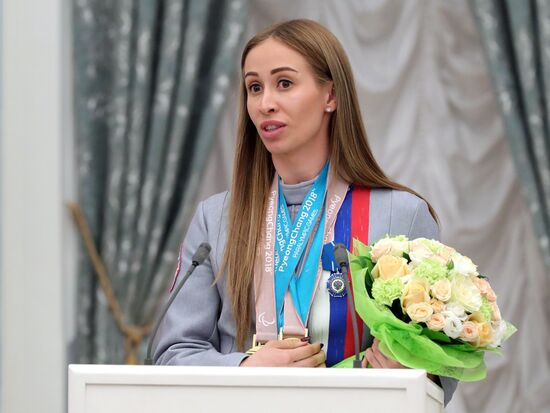Russian President Vladimir Putin meets with Russian athletes - winners and medalists of 12th Paralympic Winter Games