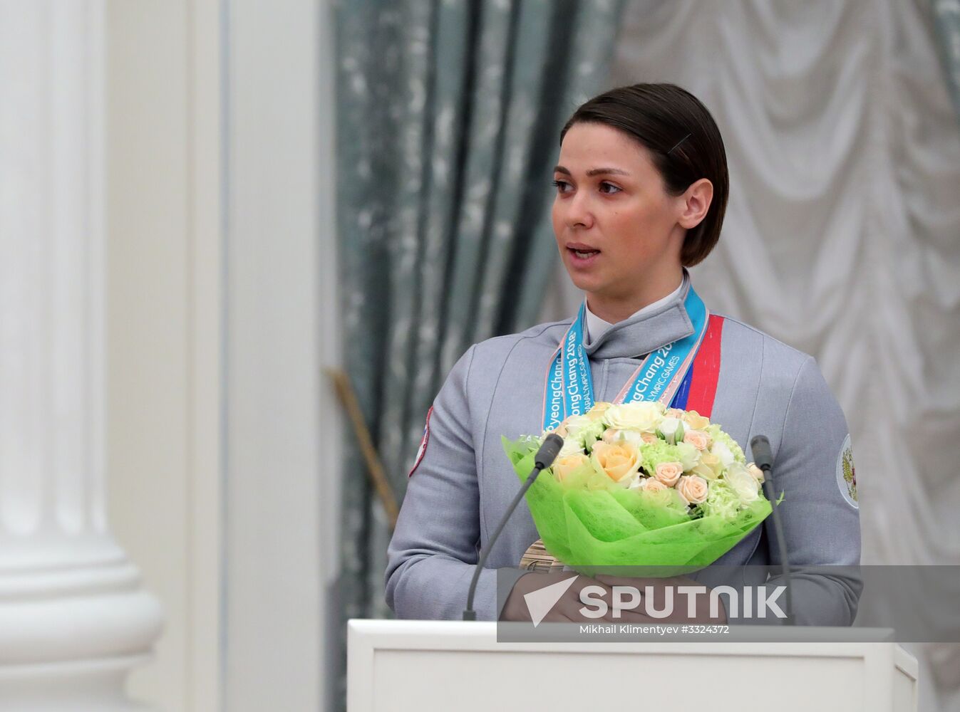 Russian President Vladimir Putin meets with Russian athletes - winners and medalists of 12th Paralympic Winter Games