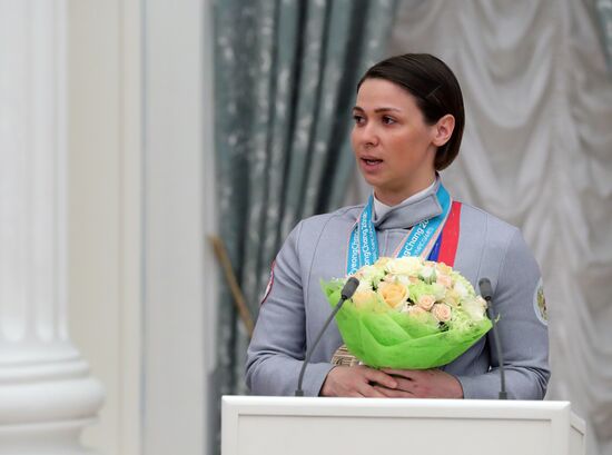 Russian President Vladimir Putin meets with Russian athletes - winners and medalists of 12th Paralympic Winter Games