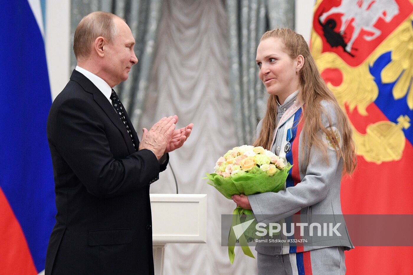 Russian President Vladimir Putin meets with Russian athletes - winners and medalists of 12th Paralympic Winter Games