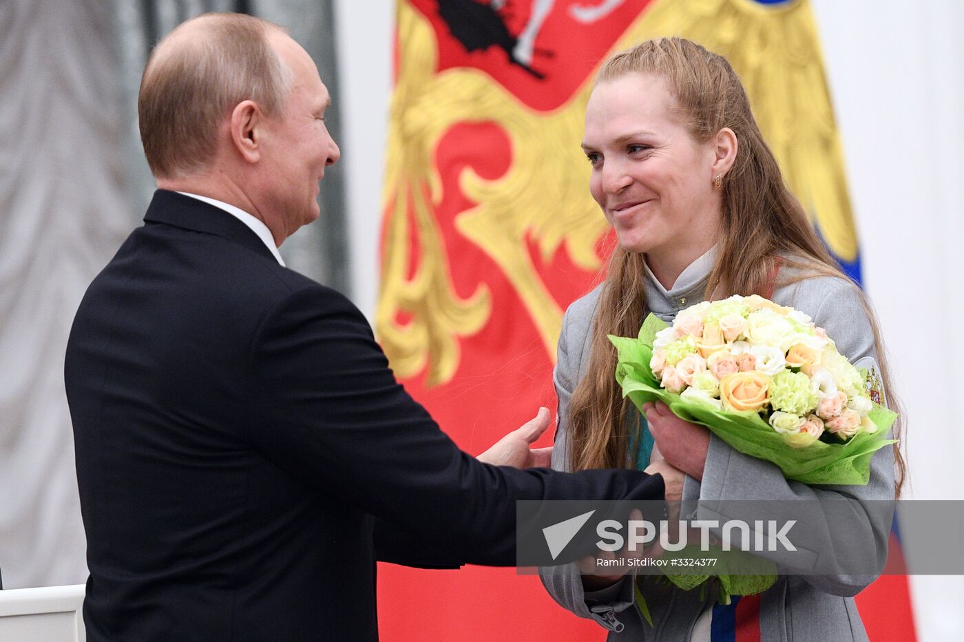 Russian President Vladimir Putin meets with Russian athletes - winners and medalists of 12th Paralympic Winter Games