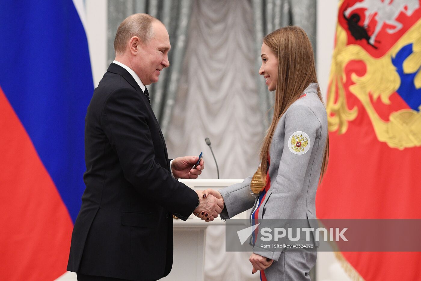 Russian President Vladimir Putin meets with Russian athletes - winners and medalists of 12th Paralympic Winter Games