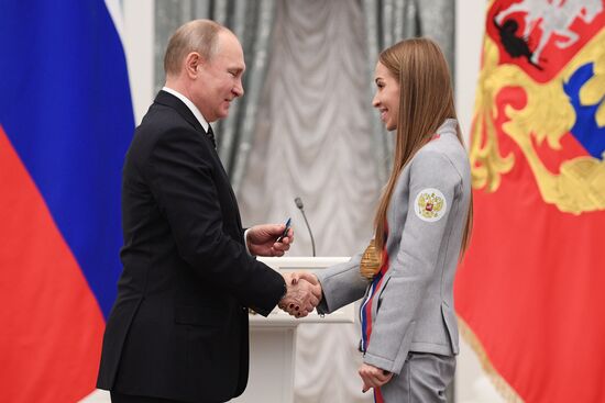 Russian President Vladimir Putin meets with Russian athletes - winners and medalists of 12th Paralympic Winter Games