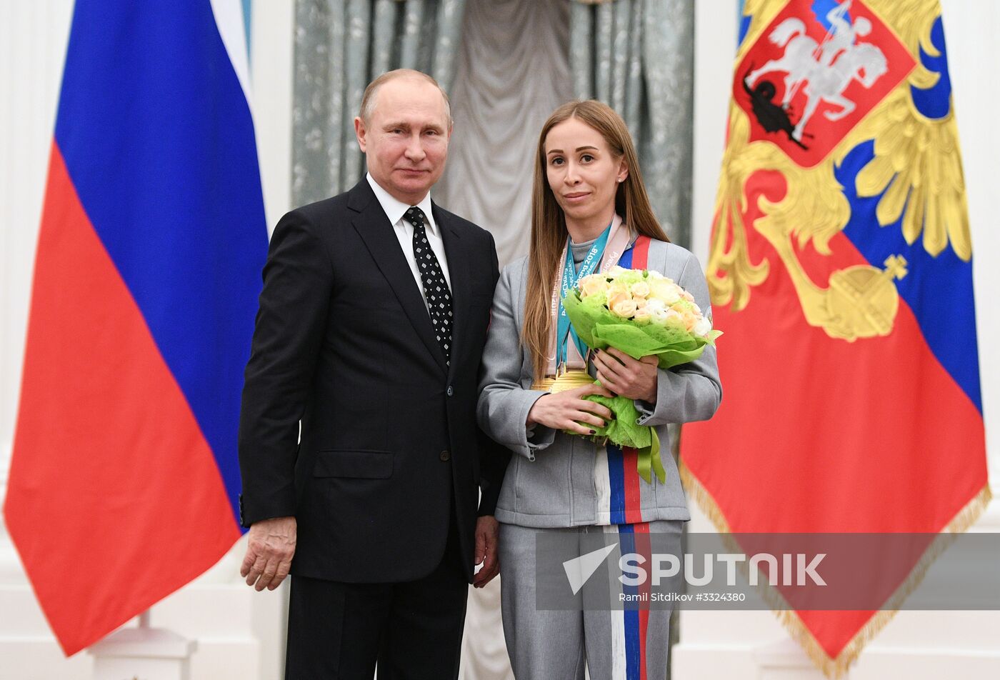 Russian President Vladimir Putin meets with Russian athletes - winners and medalists of 12th Paralympic Winter Games
