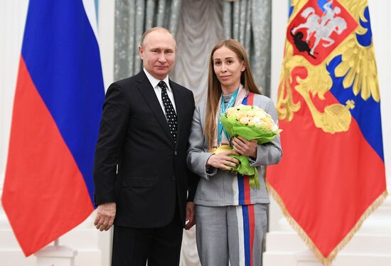 Russian President Vladimir Putin meets with Russian athletes - winners and medalists of 12th Paralympic Winter Games