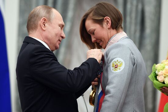 Russian President Vladimir Putin meets with Russian athletes - winners and medalists of 12th Paralympic Winter Games