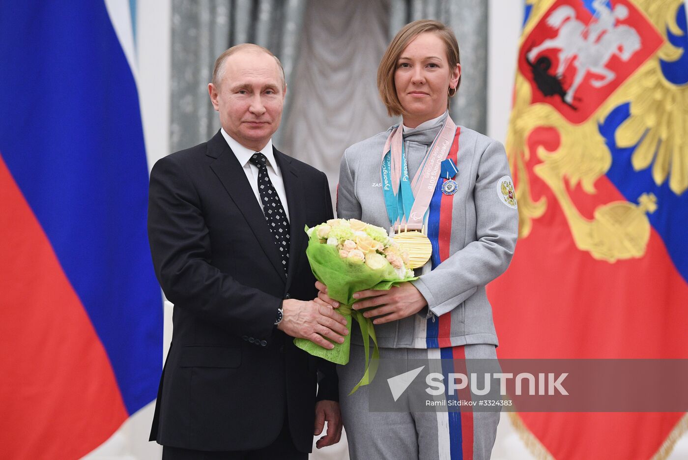 Russian President Vladimir Putin meets with Russian athletes - winners and medalists of 12th Paralympic Winter Games