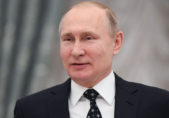Russian President Vladimir Putin meets with Russian athletes - winners and medalists of 12th Paralympic Winter Games