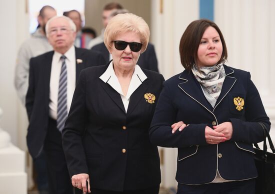 Russian President Vladimir Putin meets with Russian athletes - winners and medalists of 12th Paralympic Winter Games