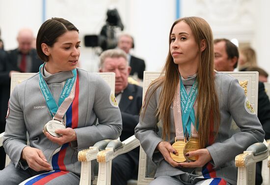 Russian President Vladimir Putin meets with Russian athletes - winners and medalists of 12th Paralympic Winter Games