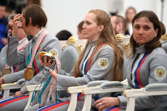 Russian President Vladimir Putin meets with Russian athletes - winners and medalists of 12th Paralympic Winter Games