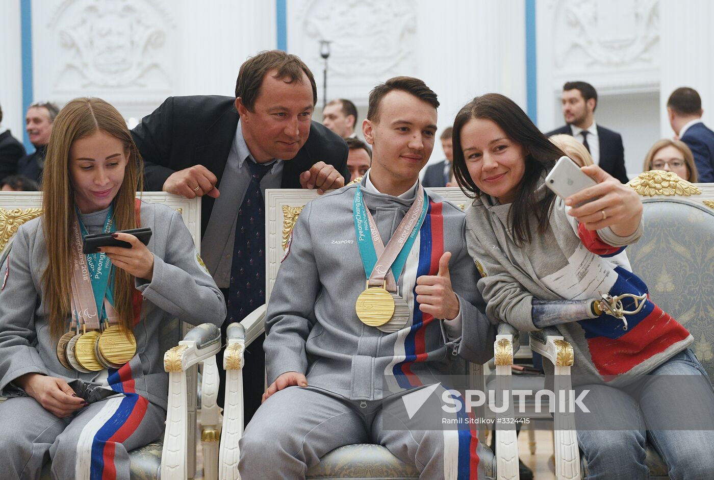 Russian President Vladimir Putin meets with Russian athletes - winners and medalists of 12th Paralympic Winter Games