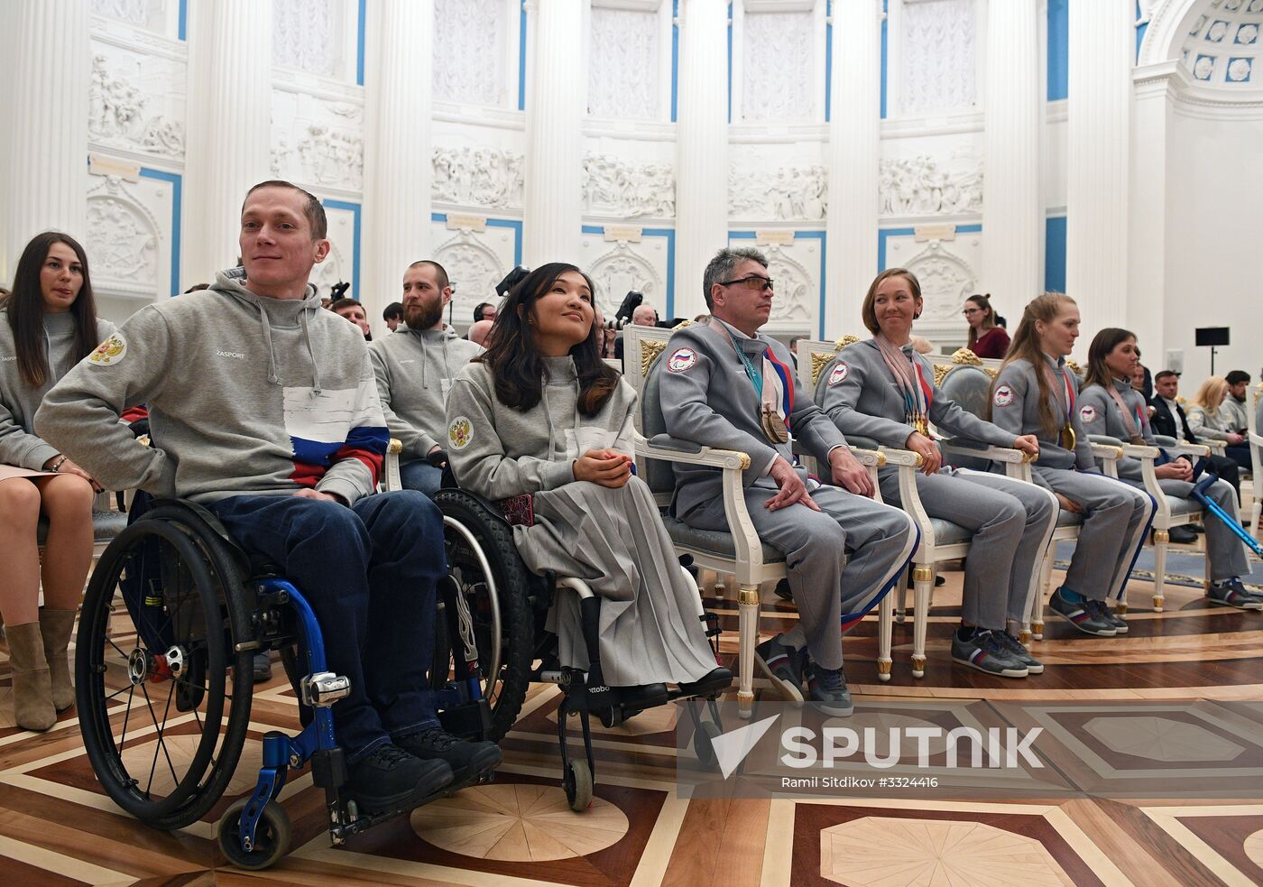 Russian President Vladimir Putin meets with Russian athletes - winners and medalists of 12th Paralympic Winter Games