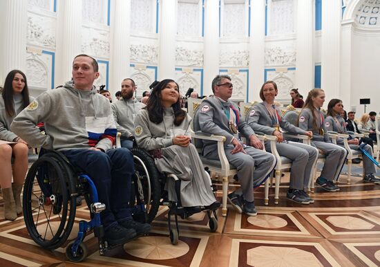 Russian President Vladimir Putin meets with Russian athletes - winners and medalists of 12th Paralympic Winter Games