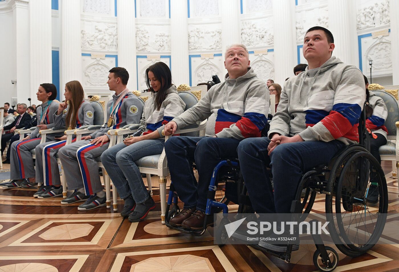 Russian President Vladimir Putin meets with Russian athletes - winners and medalists of 12th Paralympic Winter Games
