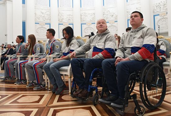 Russian President Vladimir Putin meets with Russian athletes - winners and medalists of 12th Paralympic Winter Games