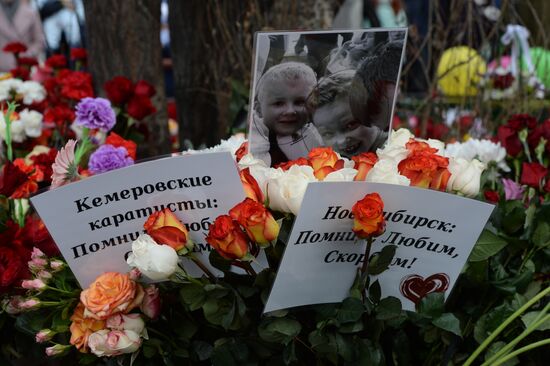 Flowers in memory of Zimnyaya Vishnya shopping mall victims