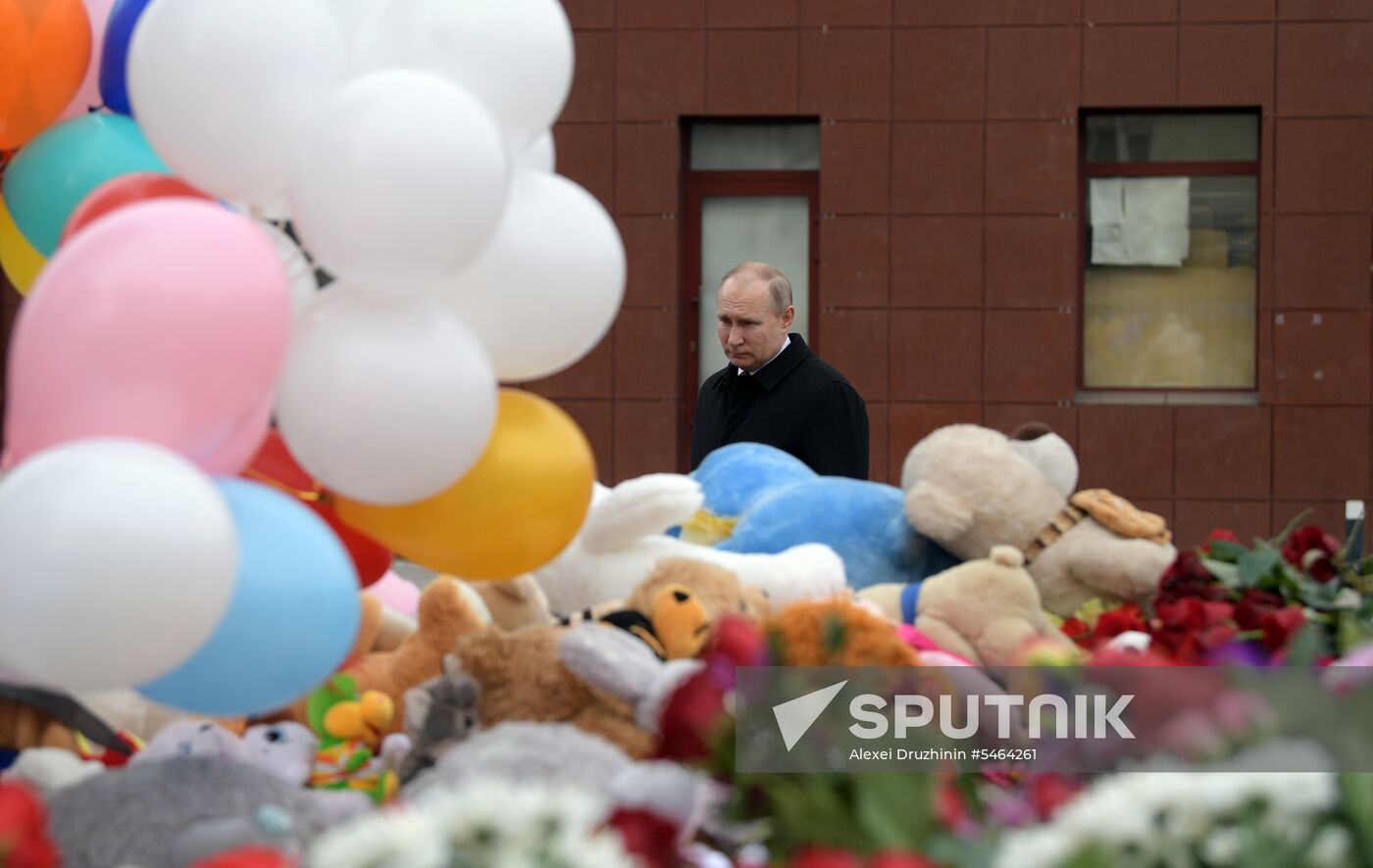 Russian President Vladimir Putin honors the memory of Kemerovo fire victims