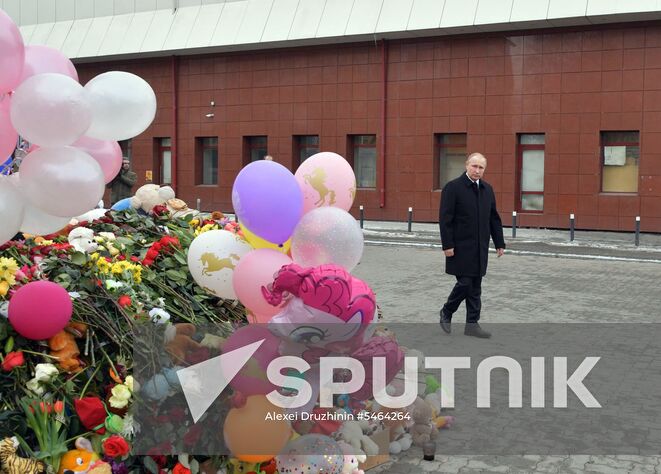 March 27, 2018. Russian President Vladimir Putin lays flowers at an impromptu memorial near the Zimnyaya Vishnya shopping mall in Kemerovo to honor those killed in the shopping mall fire. Location: Russia, Kemerovo. Author: Alexei Druzhinin/Sputnik. Russian President Vladimir Putin honors the memory of Kemerovo fire victims