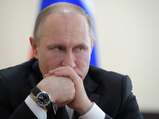 Russian President Vladimir Putin honors the memory of Kemerovo fire victims