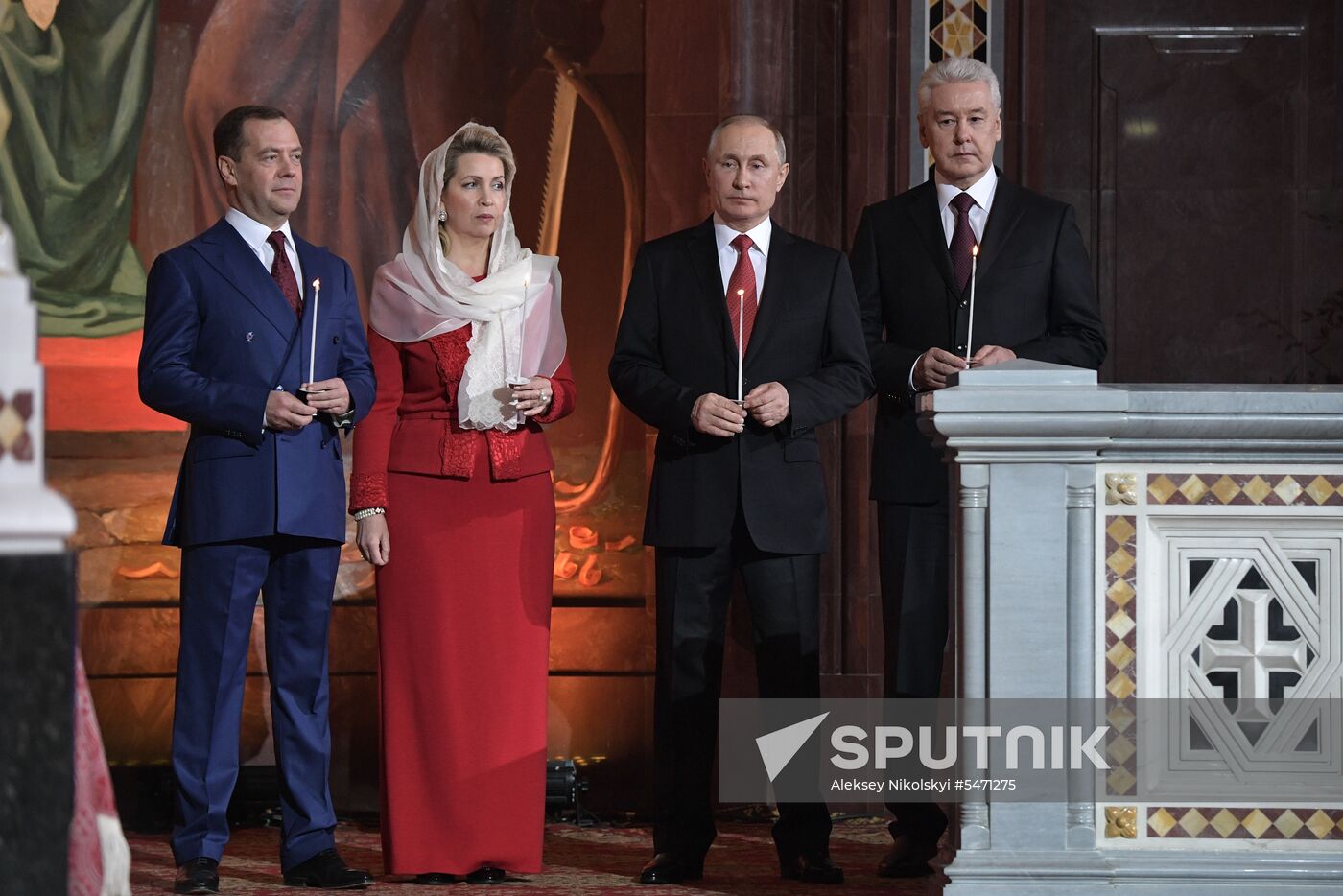 April 7, 2017. Russian President Vladimir Putin, Russian Prime Minister Dmitry Medvedev and his wife Svetlana during the Easter service at the Christ the Savior Cathedral in Moscow. Right: Moscow Mayor Sergei Sobyanin. Location: Russia, Moscow. Author: Aleksey Nikolskyi/Sputnik. Russian President Vladimir Putin and Russian Prime Minister attend Easter service