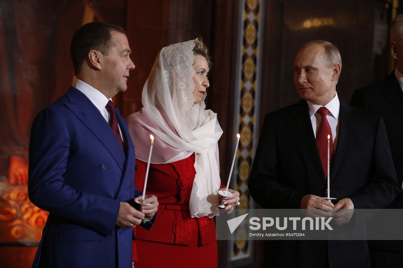 April 7, 2017. Russian President Vladimir Putin, Russian Prime Minister Dmitry Medvedev and his wife Svetlana during the Easter service at the Christ the Savior Cathedral in Moscow. Location: Russia, Moscow. Author: Dmitry Astakhov/Sputnik. Russian President Vladimir Putin and Russian Prime Minister attend Easter service