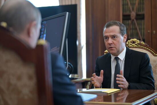 Russian President Vladimir Putin meets with Russian Prime Minister Dmitry Medvedev