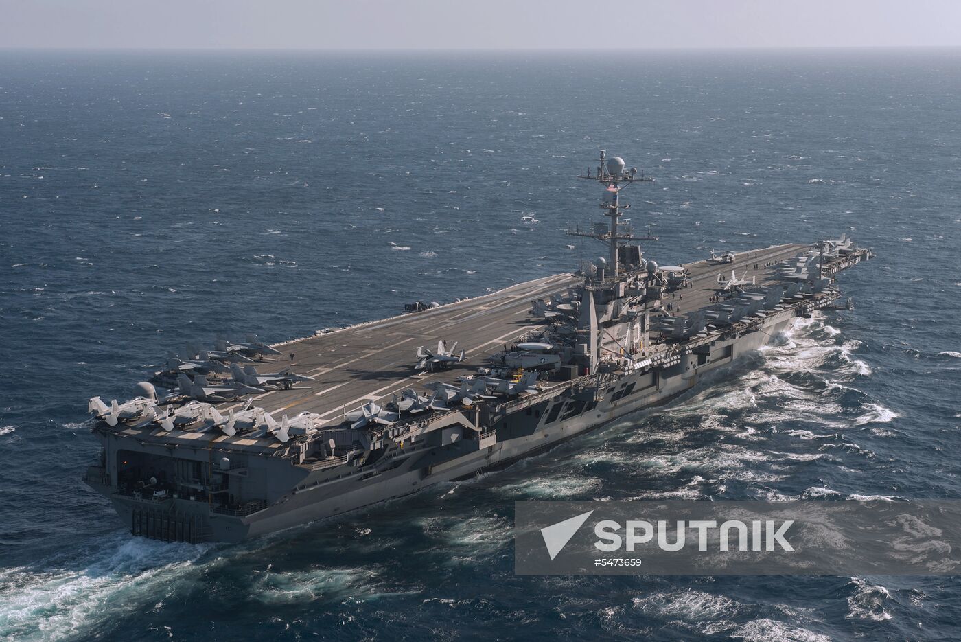 United States Navy strike group led by USS Harry S. Truman leaves port of Norfolk