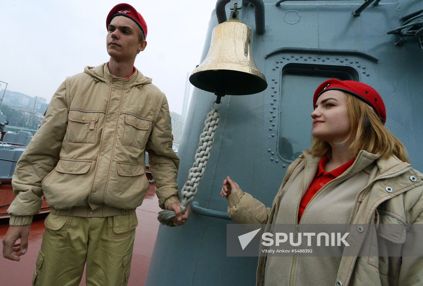 Handing children's letters over to Russian mariners aboard Varyag missile cruiser