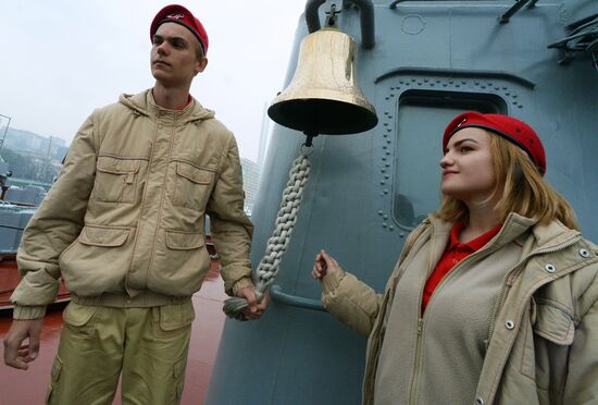 Handing children's letters over to Russian mariners aboard Varyag missile cruiser