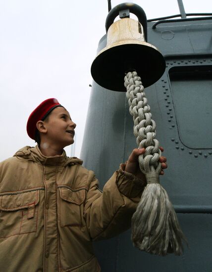 Handing children's letters over to Russian mariners aboard Varyag missile cruiser