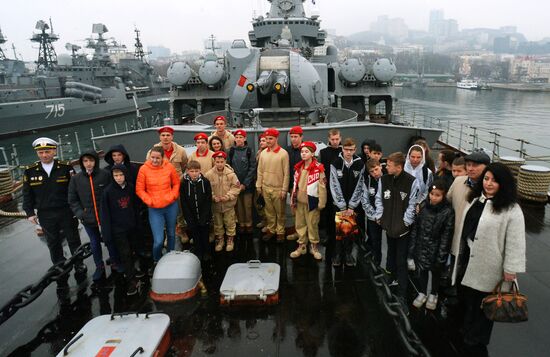 Handing children's letters over to Russian mariners aboard Varyag missile cruiser