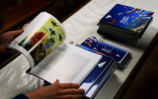 Handing children's letters over to Russian mariners aboard Varyag missile cruiser