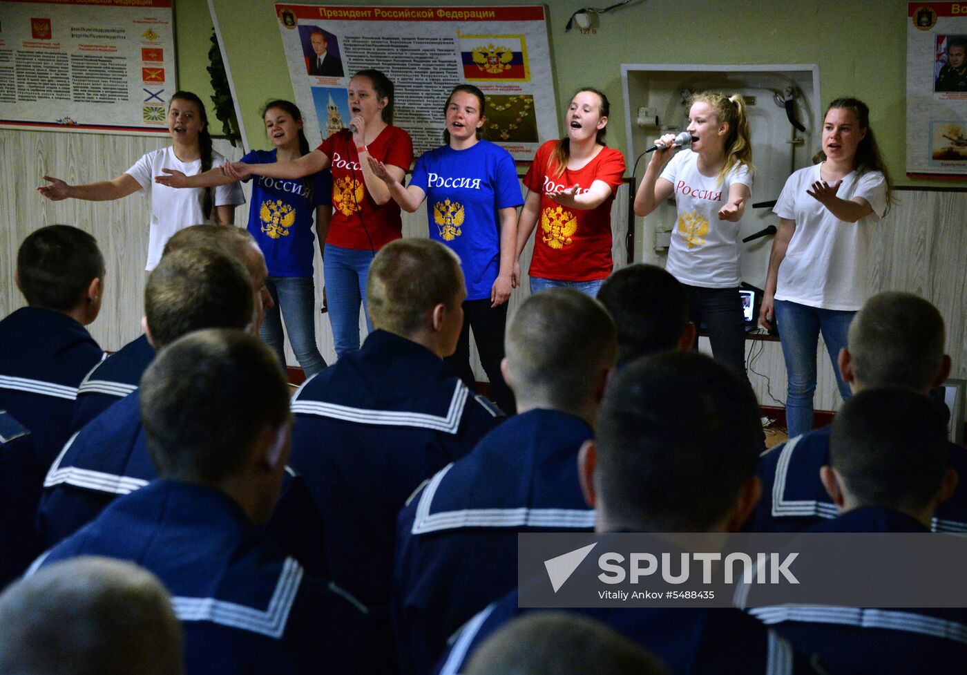 Handing children's letters over to Russian mariners aboard Varyag missile cruiser
