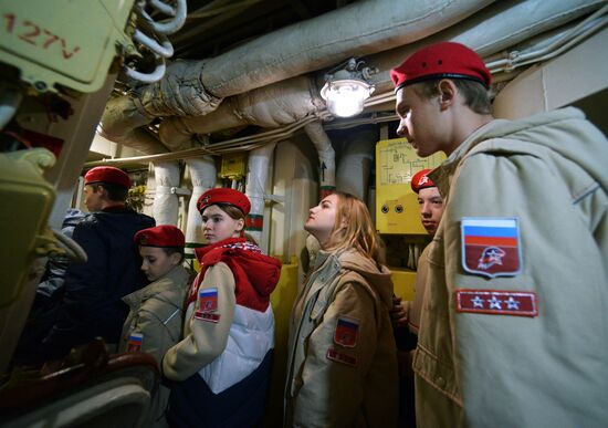 Handing children's letters over to Russian mariners aboard Varyag missile cruiser
